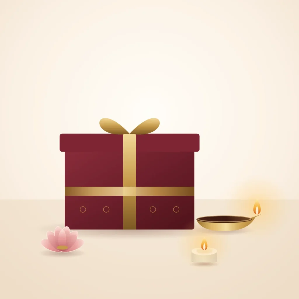 Burgundy gift box with gold ribbon, brass diya and tealight
