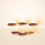 Set of six lit terracotta diyas